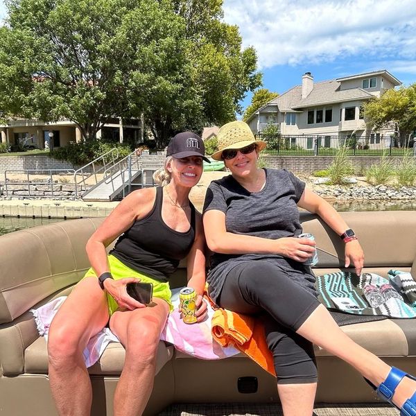 Two on the pontoon boat by the dock