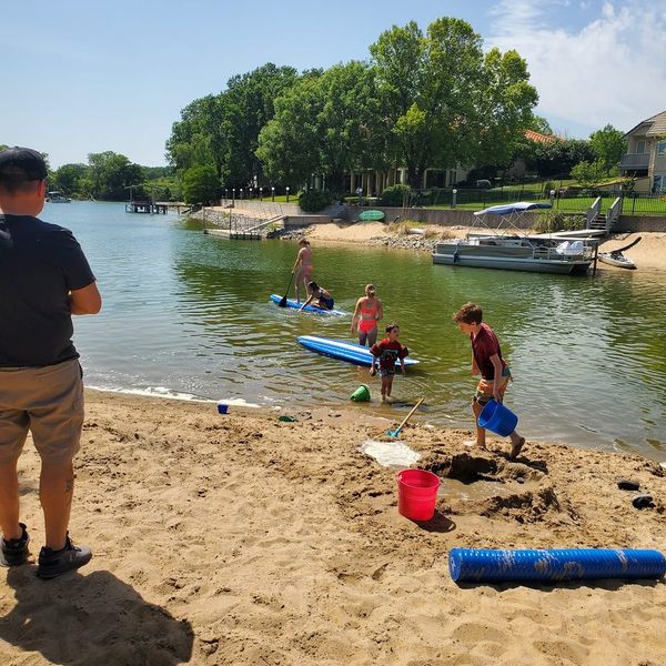 Family at the beach by the lake